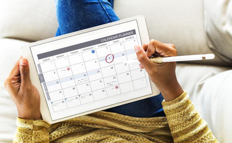 A person using a calendar on their phone